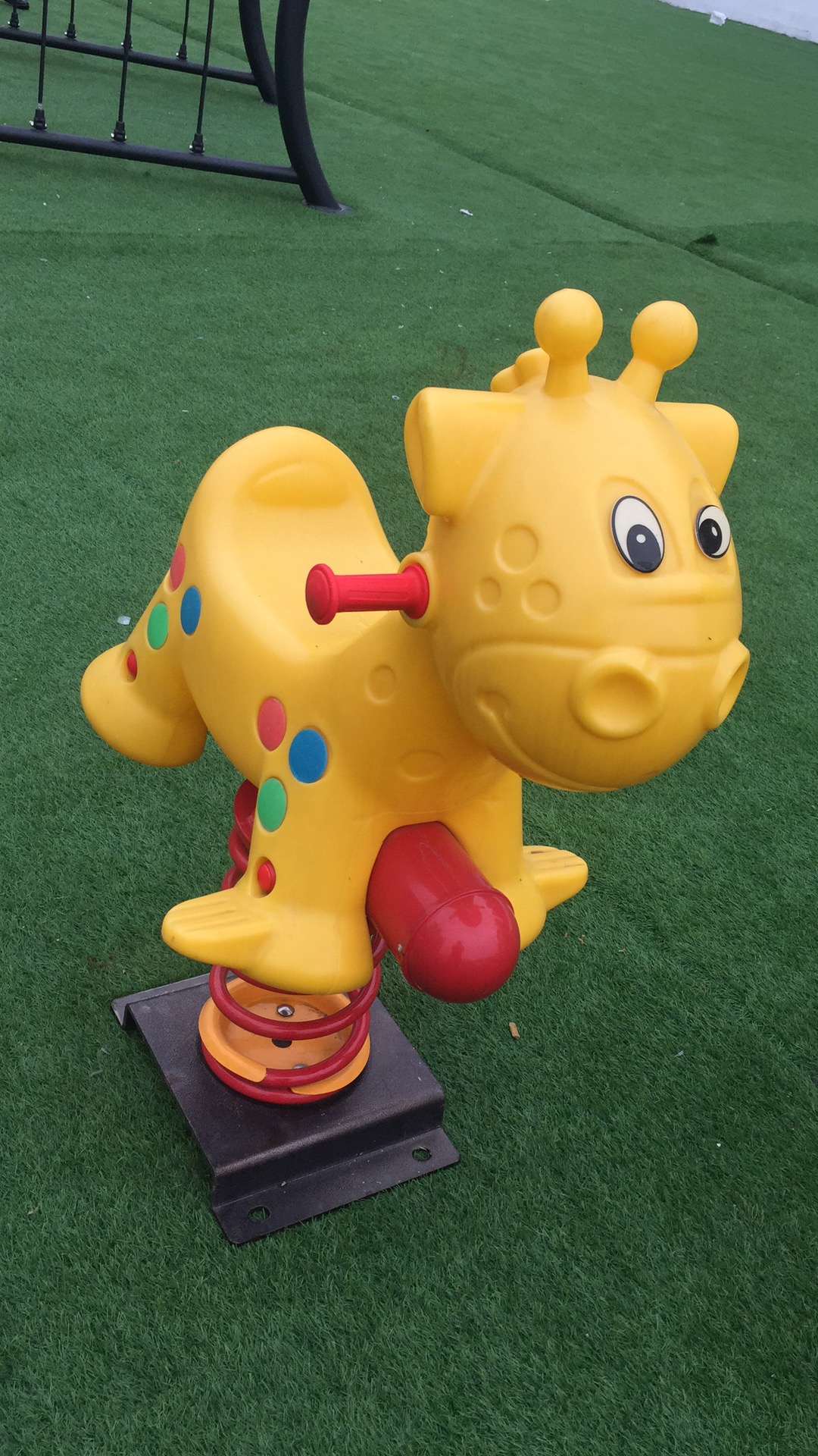 Colorful spring horse in playground park YM-031